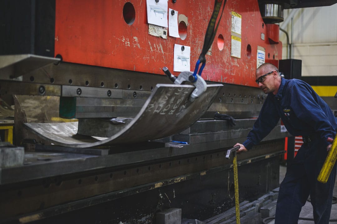 Fabricator using a press brake to form an automotive tooling component