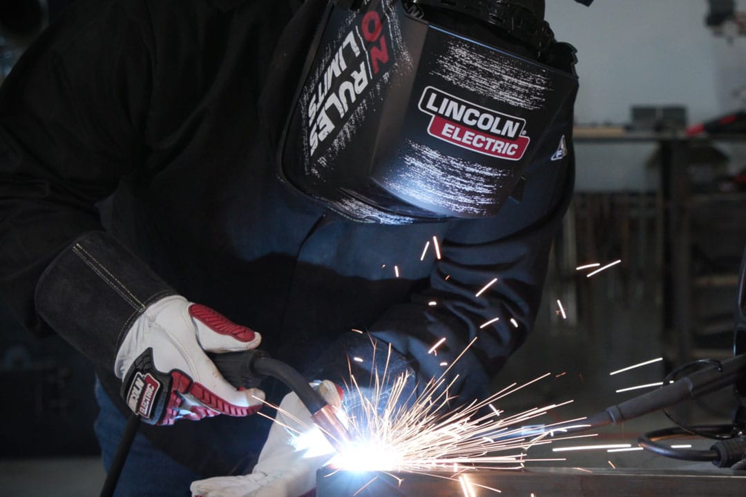 A fabricator MIG (GMAW) welding a component for large tooling or parts for the oil and gas industry